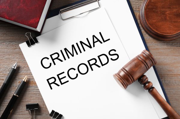 Clipboard,With,Words,Criminal,Record,And,Gavel,On,Wooden,Table,