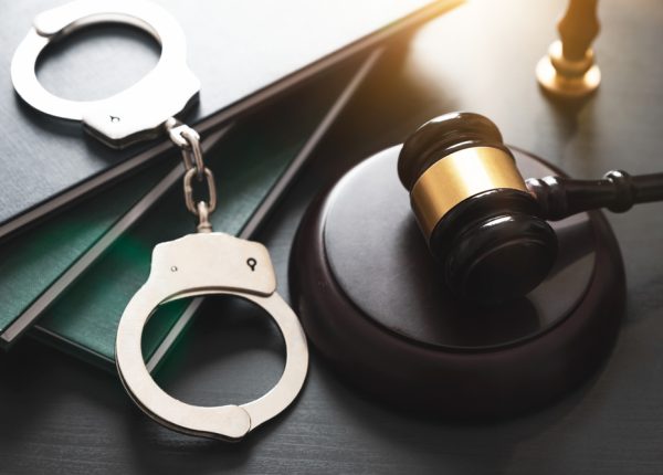 Handcuffs,And,Wooden,Gavel.,Crime,And,Violence,Concept.